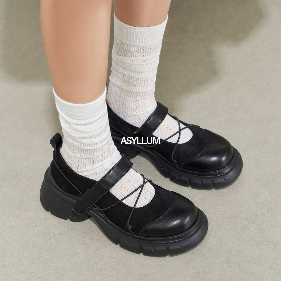 black mary jane sneakers worn with white socks