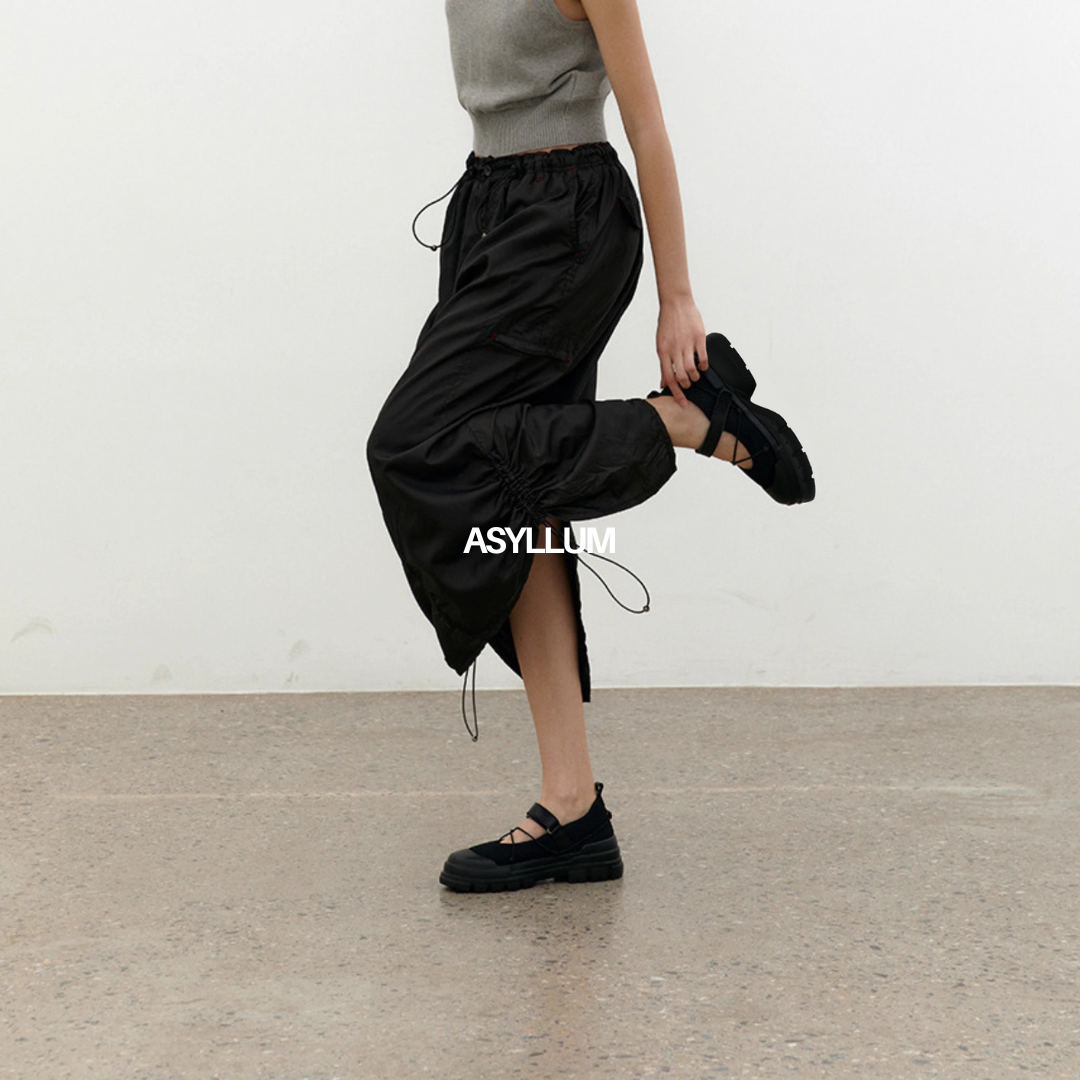 black mary jane sneakers styled with long skirt