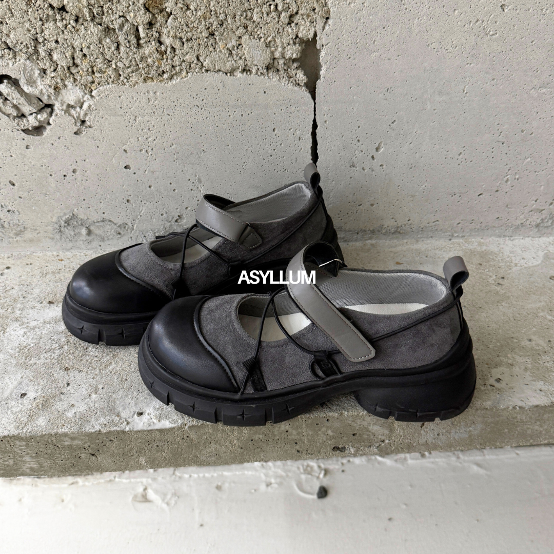 black platform mary jane sneakers pair on concrete