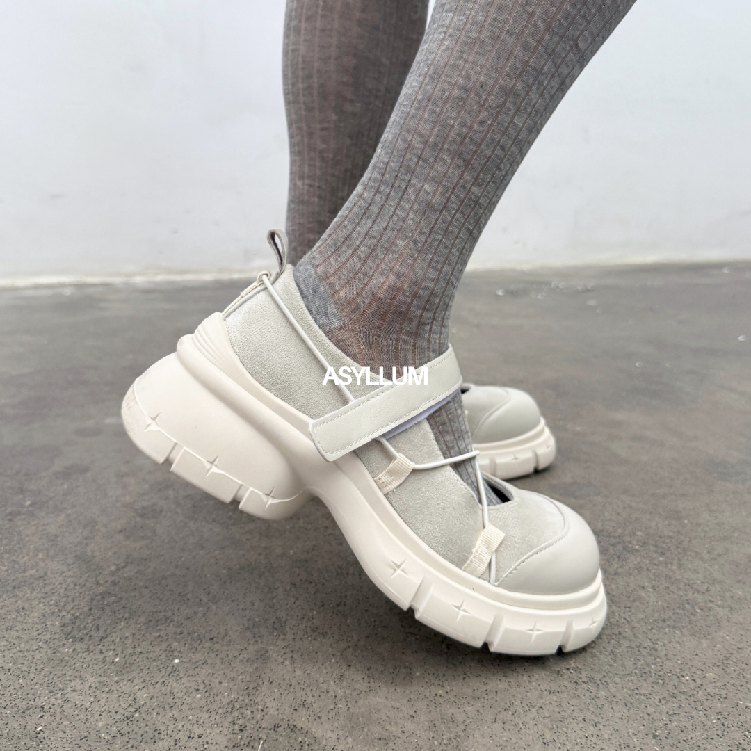 white chunky mary jane sneakers worn with socks