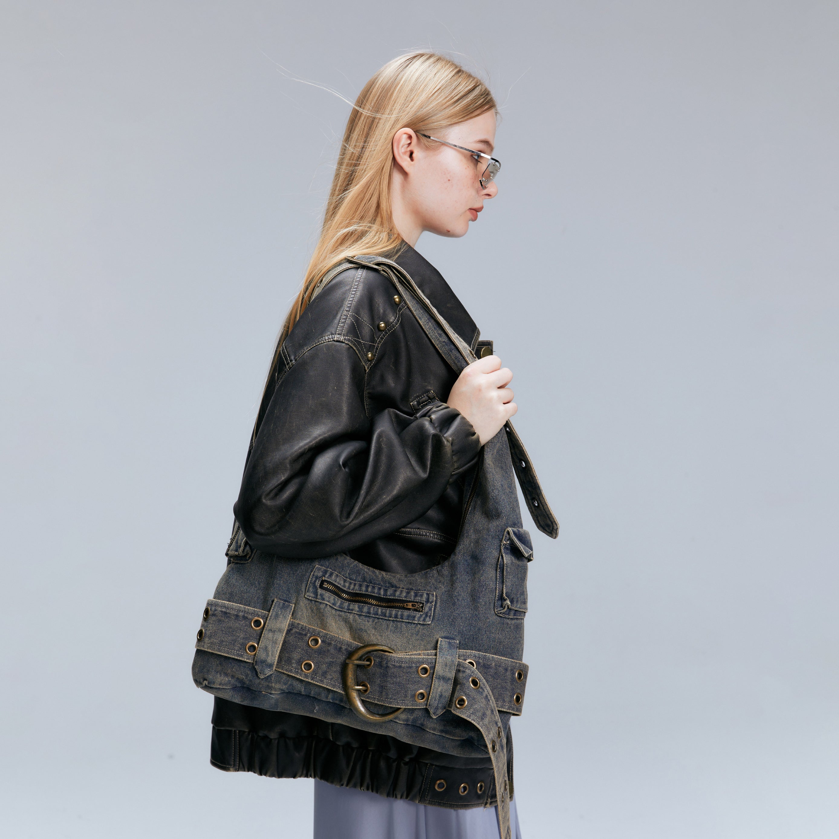 denim y2k crossbody hobo bag styled with leather jacket