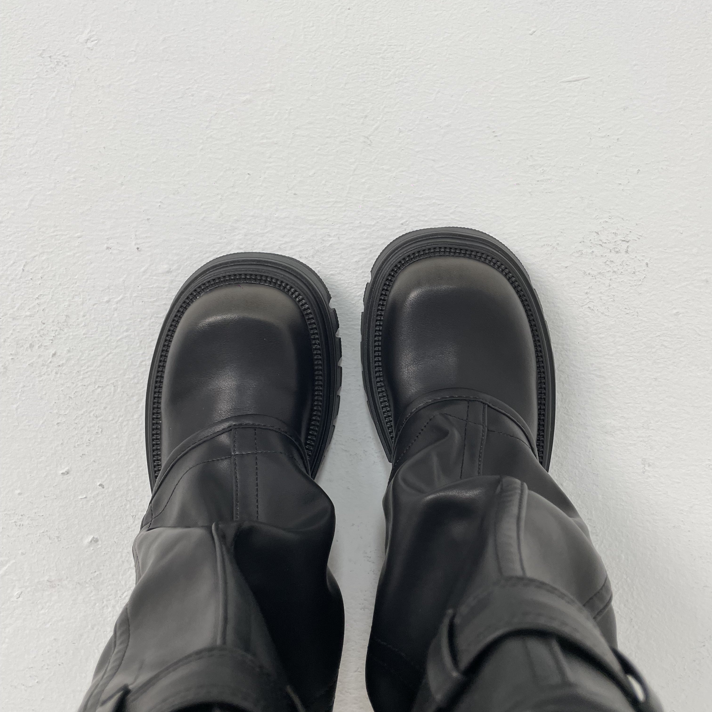 black slouchy fold over boots top view